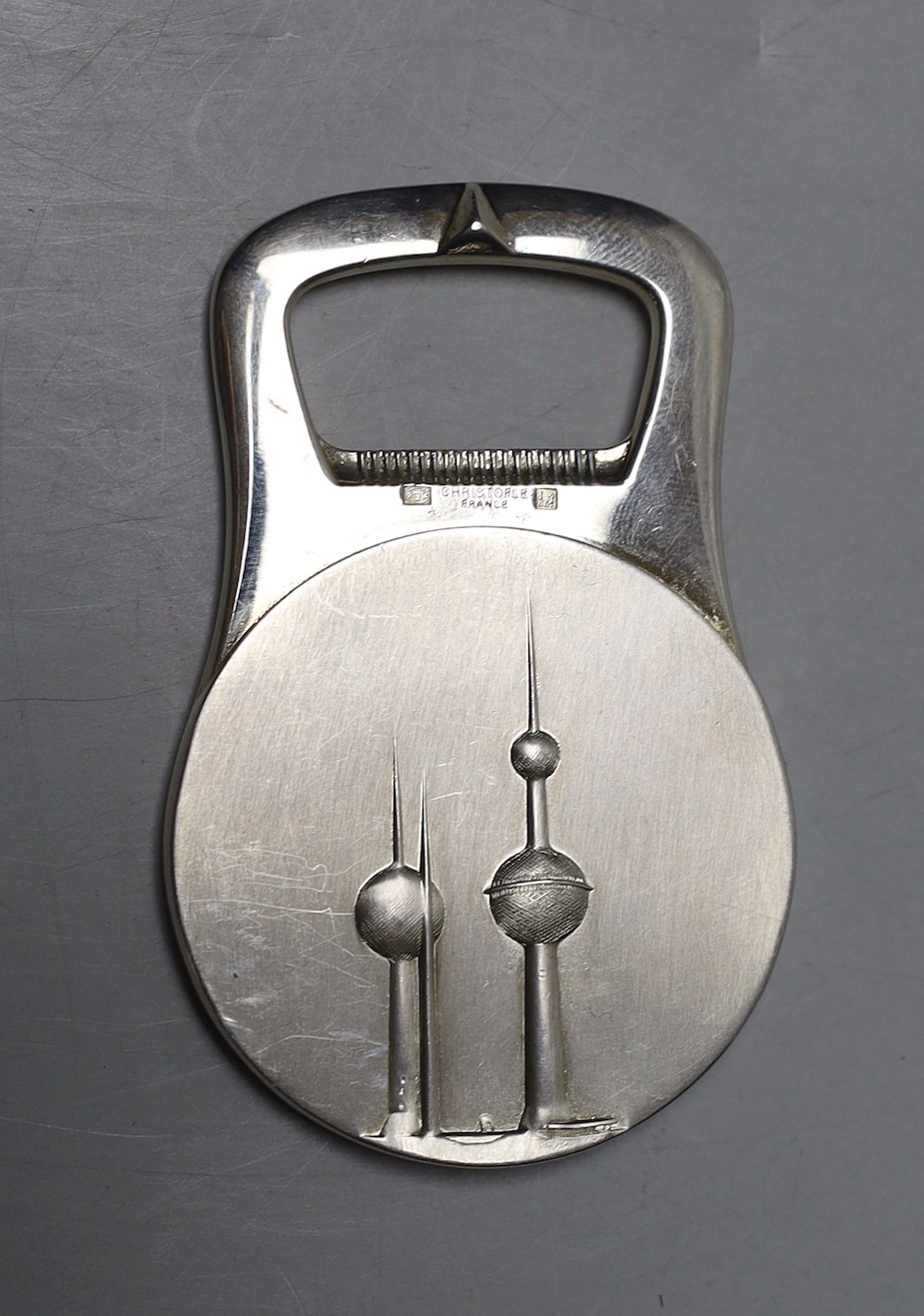 A Christofle plated bottle opener